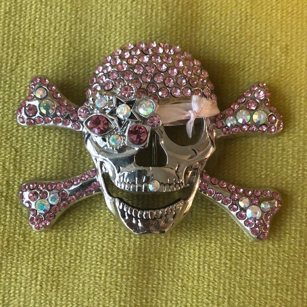 Pink and clear gem skeleton belt buckle.